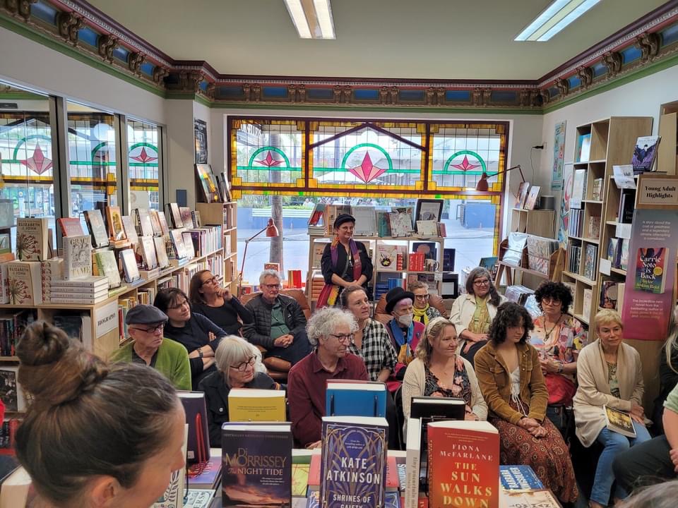 Friends and prospective readers gathered to my first launch. These include artist Derek Kreckler in the back row, musician Mel Wishheart, Judy Burke, artist Lesley Goldachre, and in the front Row artist Kendal Heyes and marketer and former colleague/friend Joan Martin.