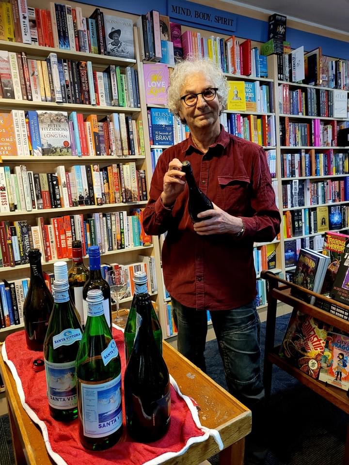 Champers anyone? Kendal Heyes helping to celebrate a memoir that he workedon hard behind the scenes in Anne Howell's editing team.